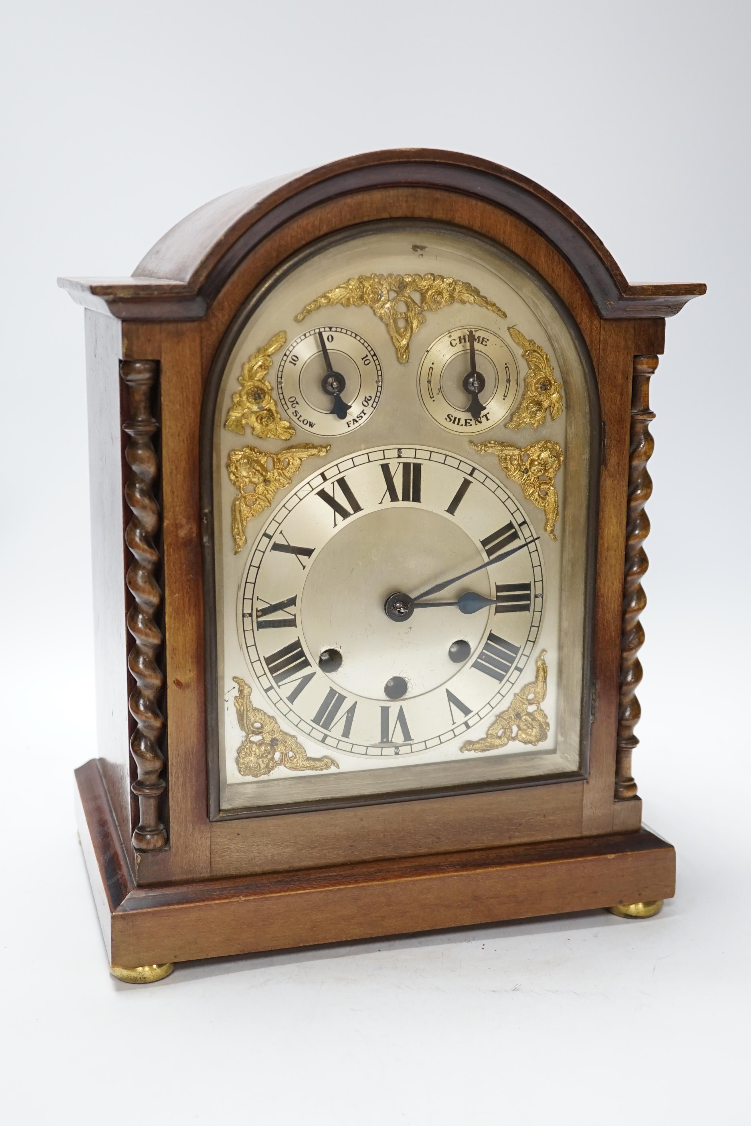 An early 20th century mahogany chiming bracket clock with silvered Roman numeral dial, 34cm high